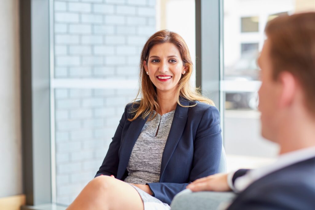 Businesswoman and businessman meeting in office