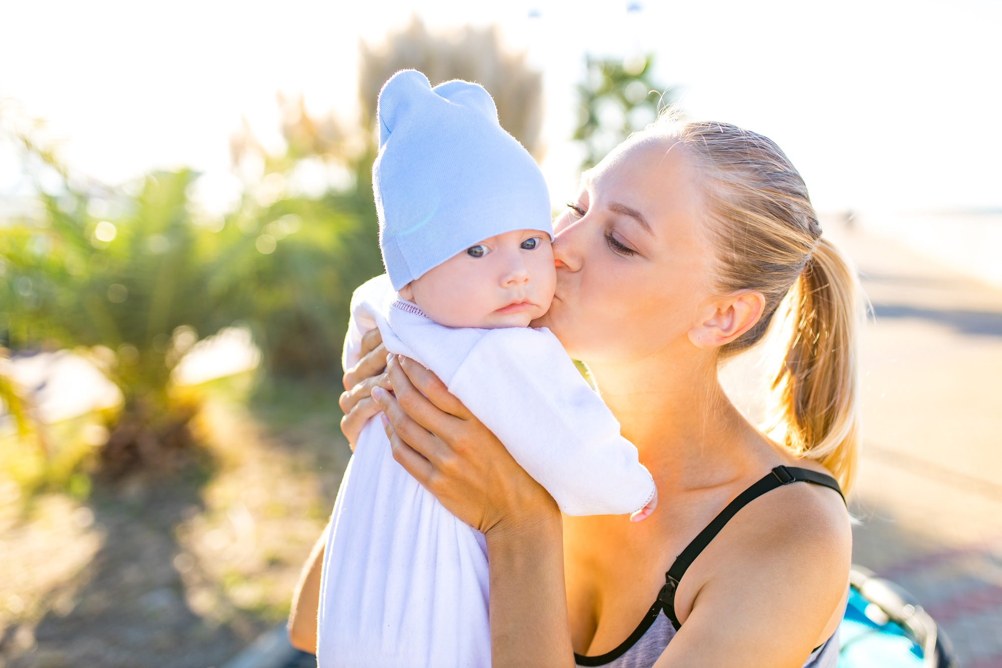 endorphin oxytocin hormone feeling of mother to her cute baby outdoors in tropical beach